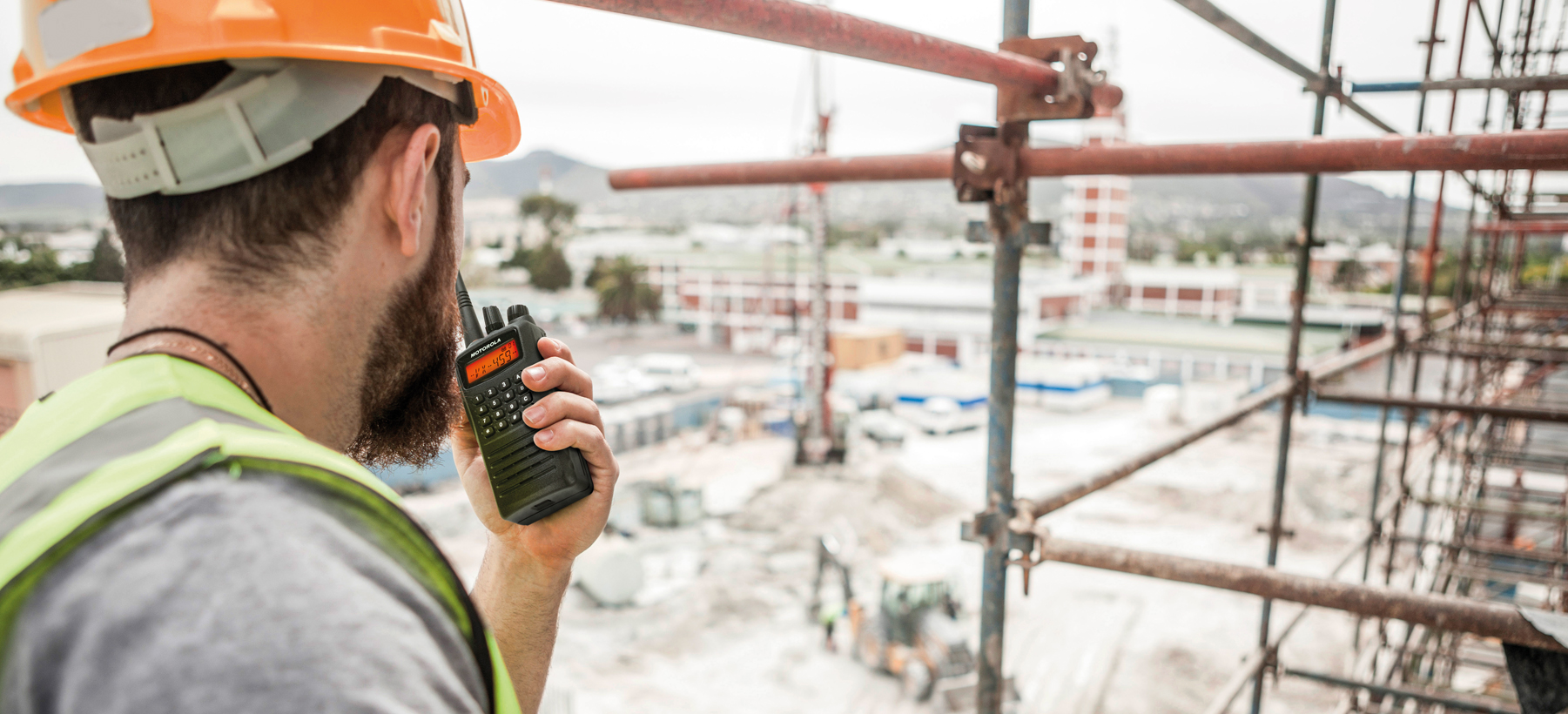 A worker using a Motorola Walkie talkie